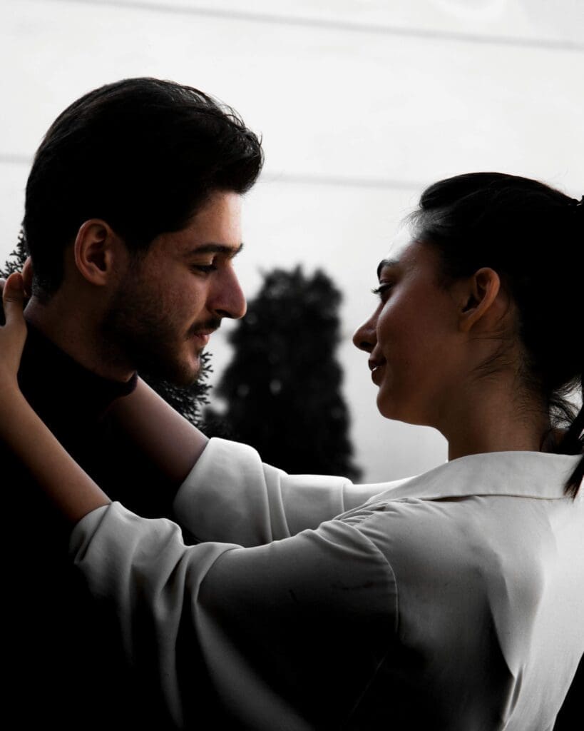 A couple faces each other. Is communication breaking down because deeper trauma is quietly shaping how you and your partner show up for each other? Relational trauma therapy in Palm Beach, FL, can help you both heal the roots of disconnection.