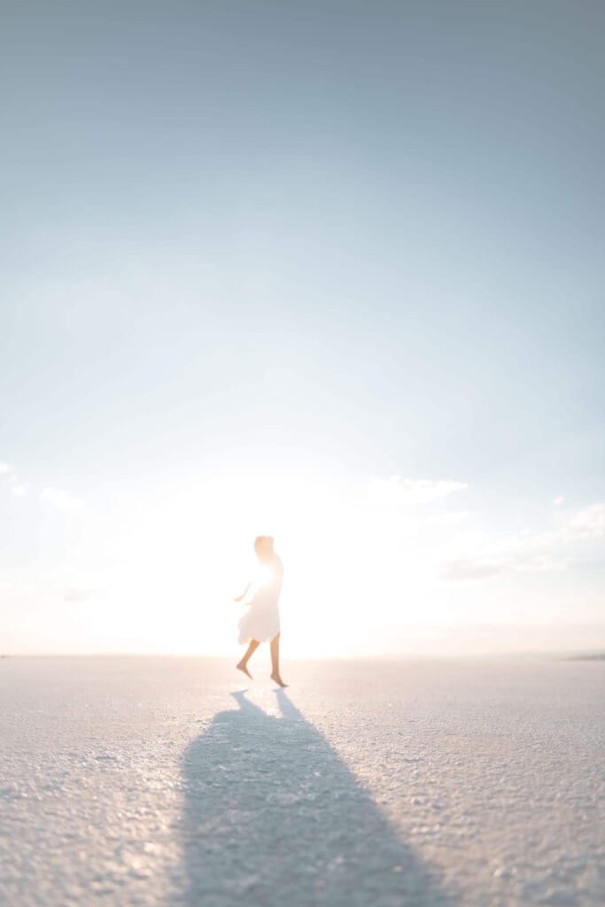 White dress | summer pressure and high achieving women | complex ptsd online therapist palm beach, fl | relational trauma therapy | Palm Beach, Florida | Wellington | Boynton Beach | The Island | The Colony Hotel A woman in a white dress walks across a sun-drenched beach. Are you a high-achieving woman who keeps moving forward through summer while feeling lost, depleted, or disconnected? Relational trauma therapy in Palm Beach, FL, can help you reconnect.