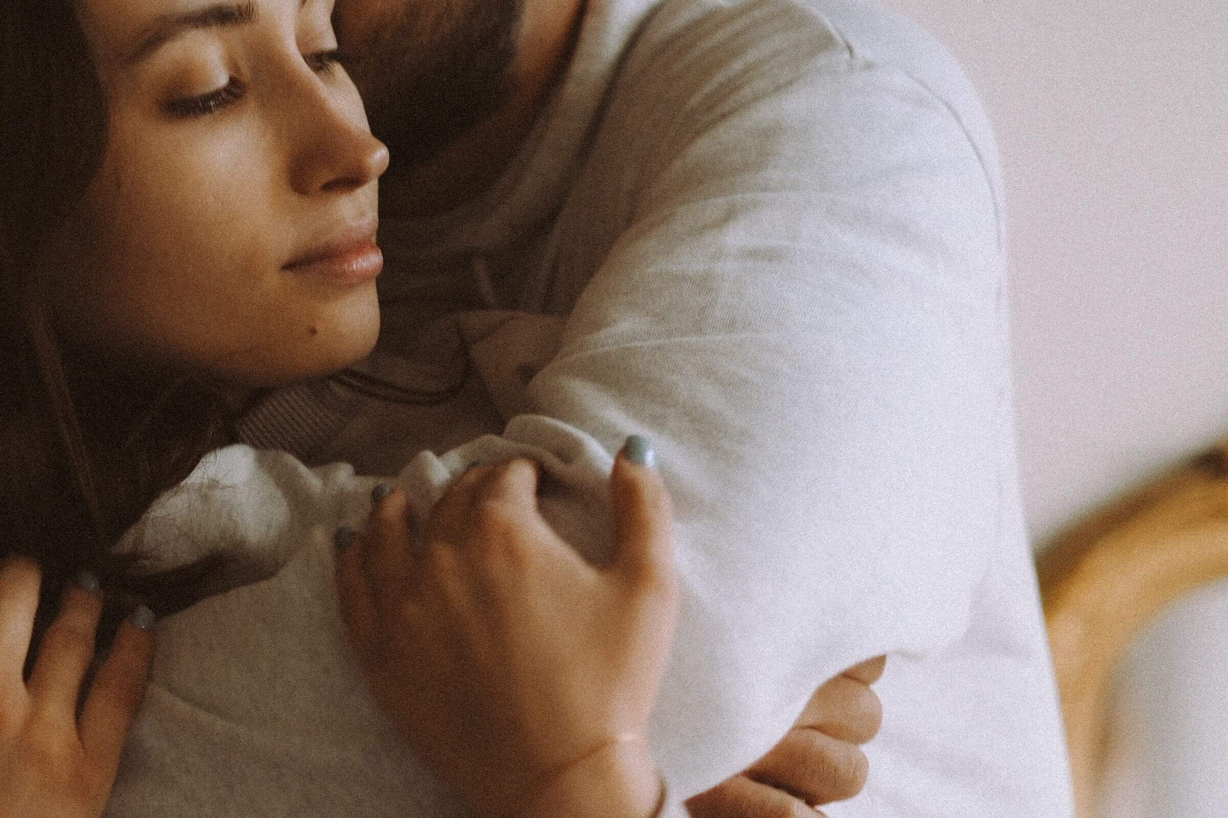 A woman rests her head against her partner's shoulder with her eyes closed. What does relationship burnout look like when you're carrying too much alone? A relational trauma therapist in Palm Beach, FL can help you find balance again.