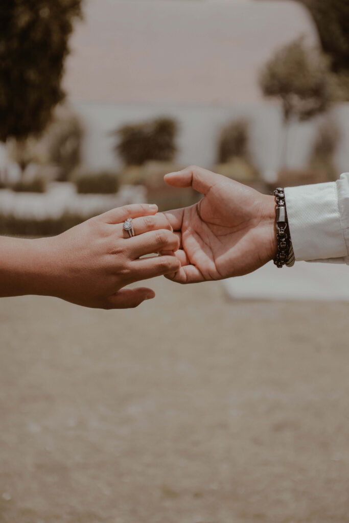 Hands reaching | emotional effort in relationships palm beach | complex ptsd online therapist palm beach, fl | relational trauma therapy | Palm Beach, Florida | Wellington | Boynton Beach | The Island | The Colony Hotel Two hands reach toward one another, almost touching, with a ring visible on one hand. Why does emotional work often fall unevenly on one partner? Relational trauma therapy in Palm Beach, FL can help both partners meet each other halfway.