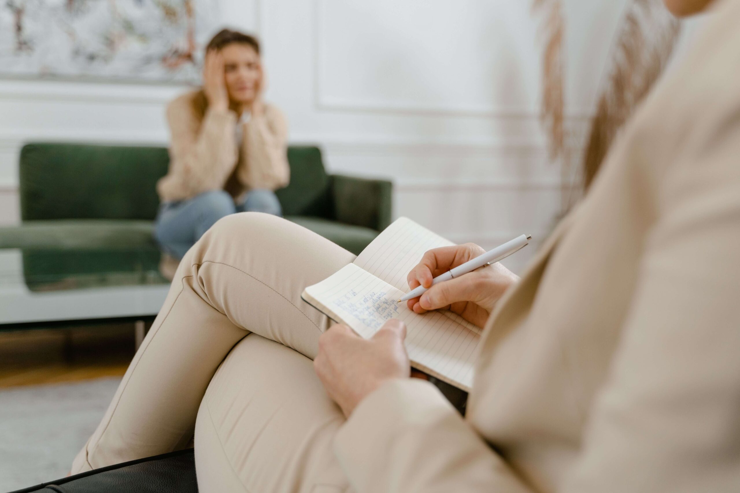 A therapist jots down notes while a client sits across the room with her hands on her face. How do you know when therapy is truly working? Online relational trauma therapy in Palm Beach, FL centers the relationship as the foundation of healing.