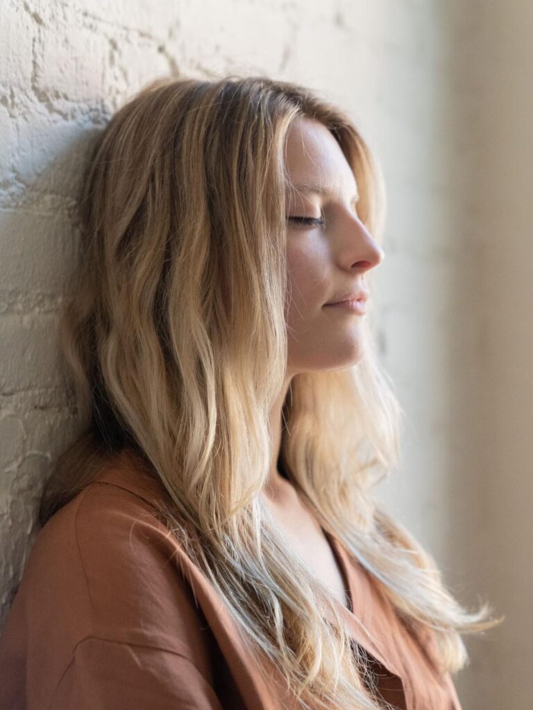 Calm woman | emotional suppression palm beach, fl | complex ptsd online therapist | relational trauma therapy | Palm Beach, Florida | Wellington | Boynton Beach | The Island | The Colony Hotel A calm woman leans her head against a wall. Could looking calm on the outside mean you're actually emotionally disconnected within? An online relational trauma therapist in Palm Beach, FL can help you understand what's happening beneath the surface.