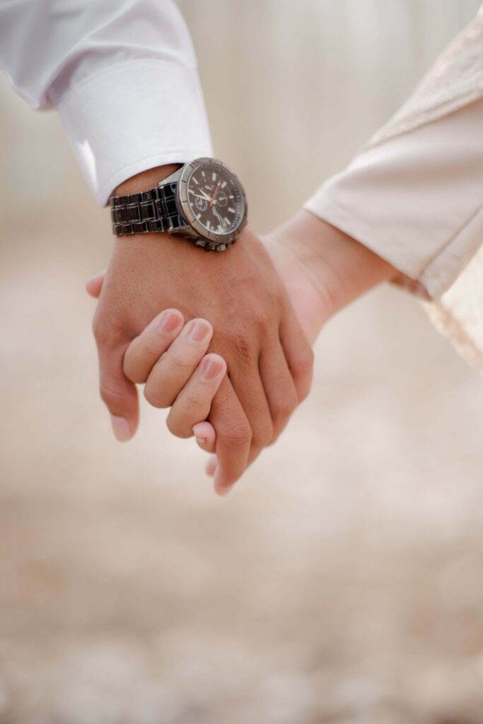 A couple holds hands closely, one wearing a watch, as they walk together. Why does leaning on someone else sometimes feel riskier than staying self-reliant? Online relational trauma therapy in Palm Beach, FL supports you in building trust in relationships and in yourself.